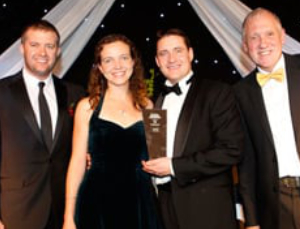 David Duffy with winners Alastair & Jenny Hanson David Duffy with winners Alastair & Jenny Hanson